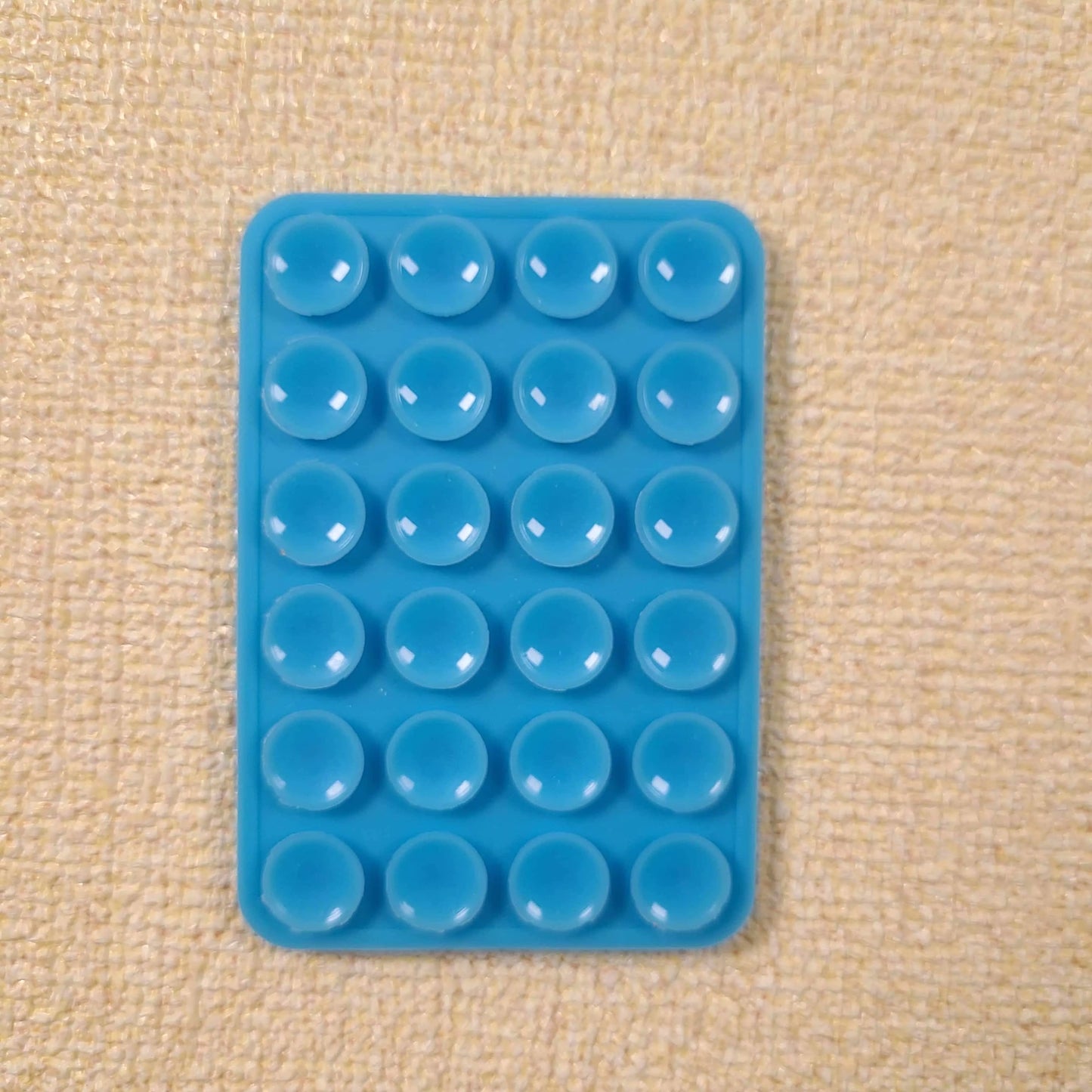 Double-Sided Silicone Suction Phone Holder – Stick, Hold & Glow!